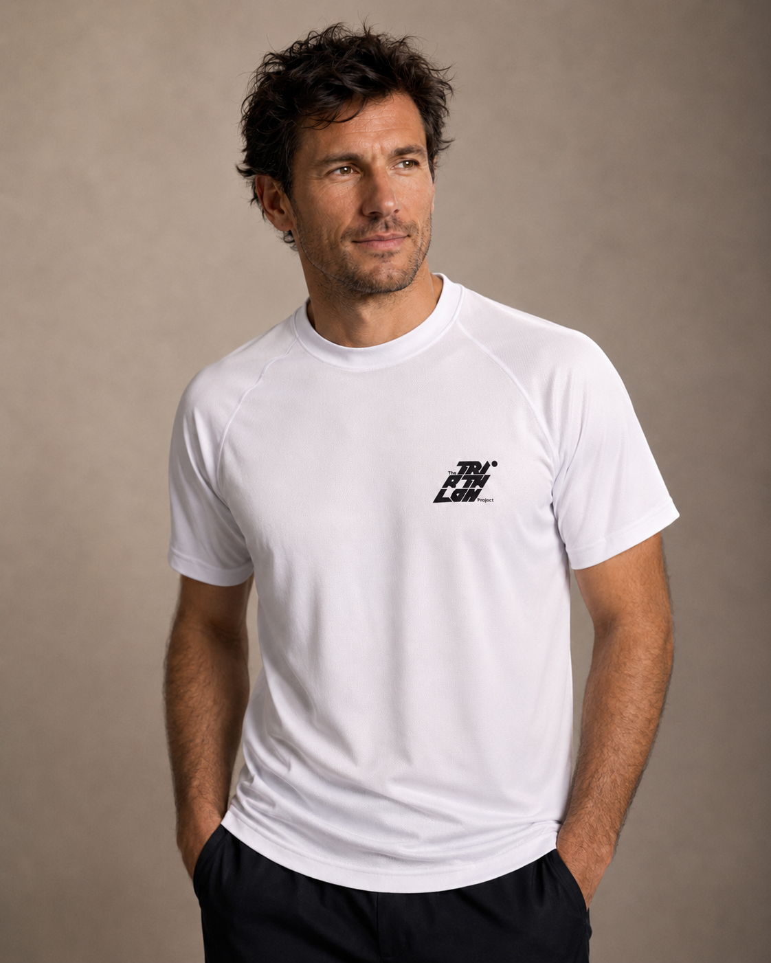 Male model wearing white sports tshirt with logo on chest